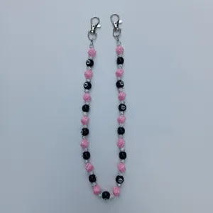 Pink dice and 8-ball beaded chain detail, stylish acrylic rhinestone pants chain and bag charm.