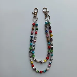 Detail view of a colorful rhinestone clay bead chain with silver lobster clasps
