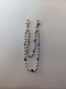 Detail showing 12mm paved glitter beads with metal clasps on a stylish hip-hop pant chain