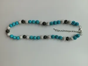Handmade Shamballa necklace featuring blue and black sparkling rhinestone clay beads