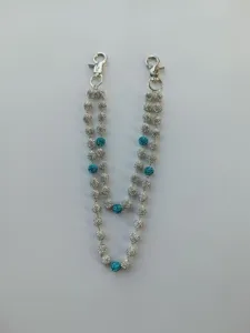 Detail view of double-layered 12mm crystal bead waist chain with turquoise accents