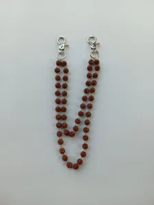 Close-up detail of a 12mm brown rhinestone disco ball chain with silver swivel hooks
