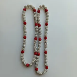 Detailed close-up of red and silver disco ball rhinestone beaded elastic necklace.
