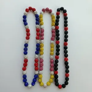 Detailed view of colorful rhinestone paved shamballa bead necklace strings, clear display.