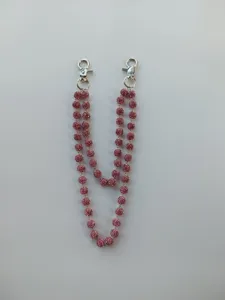 Close-up of sparkling pink rhinestone beaded chain featuring durable silver lobster clasps