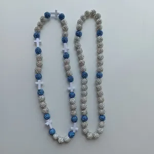 Shamballa rhinestone clay bead necklace with white cross charms, blue and silver sparkling design.