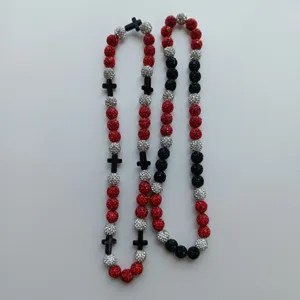 Red black silver rhinestone Shamballa beads necklace with black cross pendants, detailed view.
