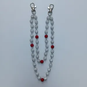 Close-up detail of 12mm sparkling disco ball beads on a silver hip-hop trouser chain