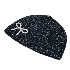 Black sequin beanie cap with elegant pearl bow design, chic winter warm knit hat for women.