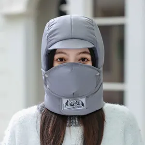 Winter warm trapper hat detail view, thick fleece-lined bomber cap with windproof face mask.