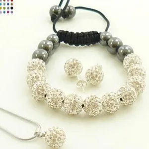 Detailed view of crystal encrusted Shamballa style jewelry set with bracelet and necklace
