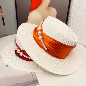 Summer French elegant pearl flat-top straw hat, perfect for travel, sun protection, and chic style.