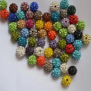 Macro view of multi-colored 10mm rhinestone clay beads for Shamballa bracelets.