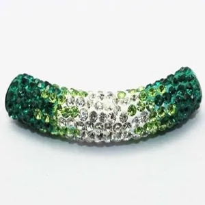 Macro view of a 45mm Shamballa curved tube bead with green and white gradient crystals.