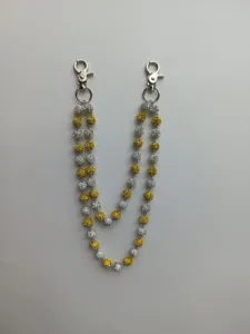 Detail view of 12mm rhinestone clay bead double trouser chain in yellow and silver