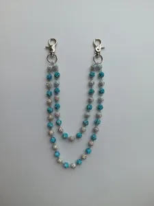 Close-up of 12mm blue and white rhinestone bead double pants chain with silver clasps