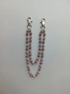 Detail of 12mm pink and silver rhinestone disco ball beads on a hip hop pant chain.