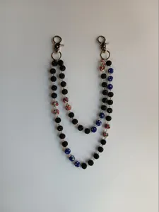 Close-up of double-layered pants chain with 12mm black and blue clay disco beads.