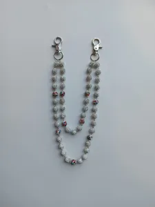 Detailed close-up of a 12mm rhinestone disco ball double strand chain for pants