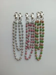 Multi-colored 12mm rhinestone bead chains with metal lobster clasps for pants or bags.