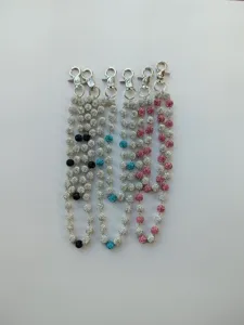 Close-up detail of 12mm rhinestone disco ball hip hop waist chains in mixed colors