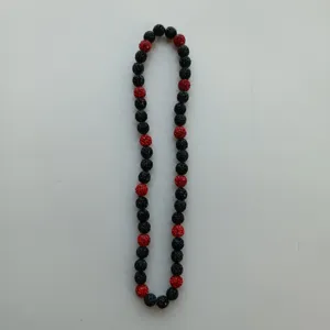 Black and red rhinestone bead necklace detail shot, sparkling shamballa style fashion jewelry.