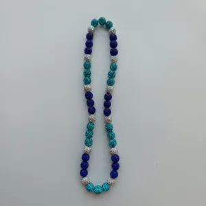 Shamballa clay rhinestone beaded necklace detail view, vibrant blue crystal disco ball beads.