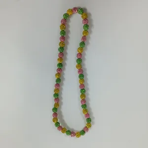 Colorful rhinestone clay bead necklace detail, sparkling crystal balls, elastic cord design.