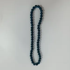 Detailed view of the dark blue rhinestone clay bead stretch necklace, showing closeup texture.