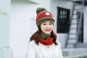 Close-up detail of the thick knitted winter beanie hat and matching warm neck set in red.
