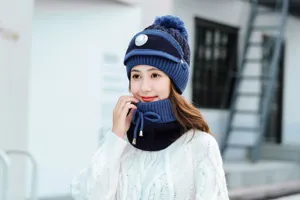 Close-up detail of the winter knitted hat and scarf set, showing the breathing valve design.