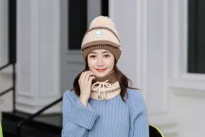 Women winter thick knitted beanie hat and neck warmer set with cute pom pom and valve detail.