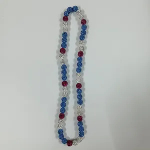 Close-up detail of colorful rhinestone clay beads necklace, sparkling shamballa style design.