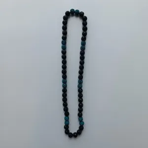 Detailed view of the Shamballa rhinestone clay bead necklace with black and blue crystal balls.