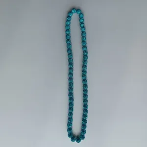 Blue rhinestone clay bead necklace detail, sparkling crystal ball strand for DIY jewelry.