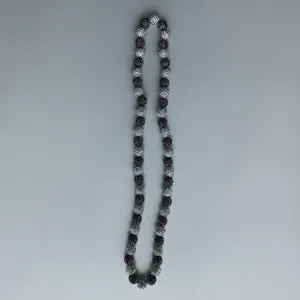 Detailed shot of sparkling Shamballa rhinestone bead necklace closeup showcasing exquisite design.