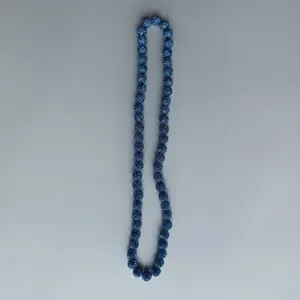 Blue rhinestone pave clay bead strand detail view, sparkling crystal ball accessories.