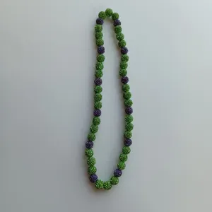 Detailed view of a green and purple rhinestone shamballa bead necklace, perfect for daily wear.