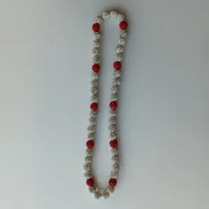 Red and silver rhinestone shamballa bead necklace close-up view, sparkling crystal clay ball design.