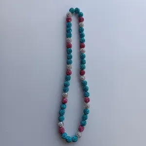 Colorful rhinestone clay bead necklace detail view showing sparkling shimmer beads strand.