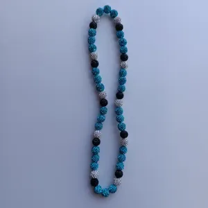 Detailed view of the Shamballa rhinestone beaded necklace showing sparkling blue and black beads.