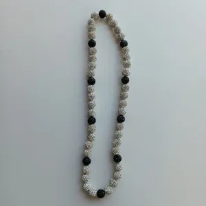 Shamballa rhinestone crystal beaded necklace featuring alternating black and clear paved balls.