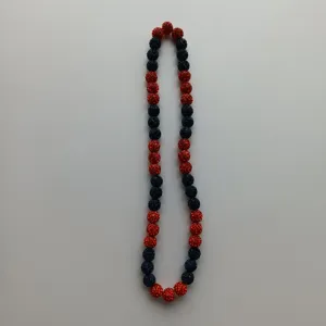 Red and dark blue crystal clay bead necklace detail view, sparkling Shamballa style beads.