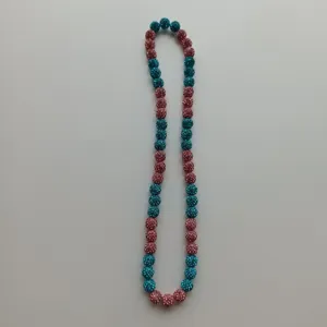 Detailed view of colorful rhinestone clay beads elastic Shamballa necklace for stylish wear.