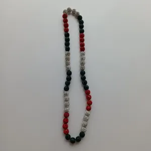 Close-up view of colorful rhinestone disco ball beads shamballa necklace detail.