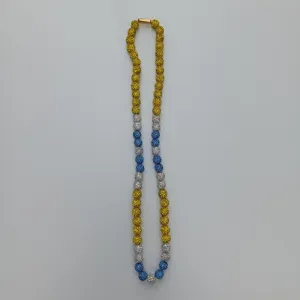 Colorful shamballa crystal clay beaded necklace detail showing yellow blue and sparkly rhinestones.