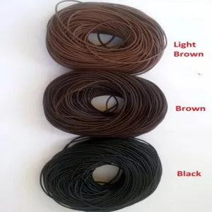 Vue de détail de cordon en cuir rond, rouleaux de fil marron et noir 1.5mm pour bijoux.