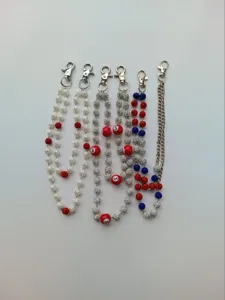 Close-up of assorted 12mm rhinestone beaded hip-hop pants chains with metal clasps