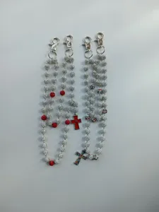 Detail view of sparkly 12mm clay rhinestone bead chains with bold cross pendants