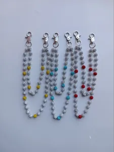 Detail of 12mm sparkling rhinestone ball chains for jeans or bags with silver clasps